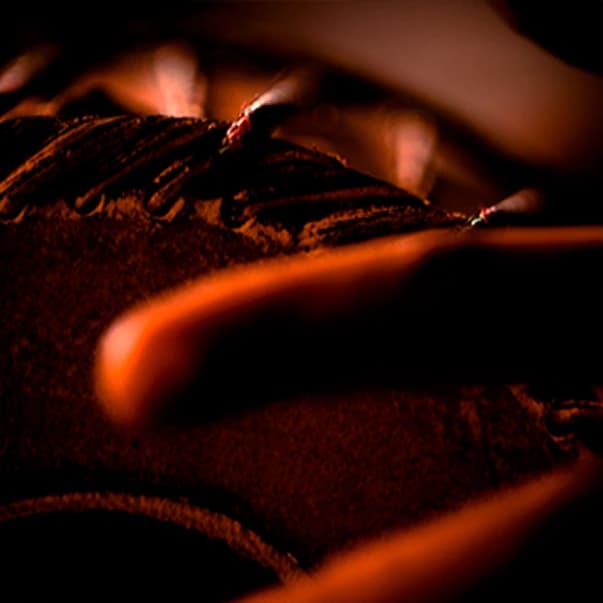 Detailed view of a traditional mridangam with textured drum surface
